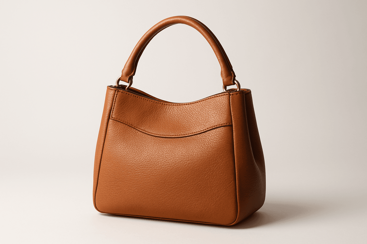 High-quality ecommerce product shot of a leather handbag on a white background with sharp focus and realistic lighting