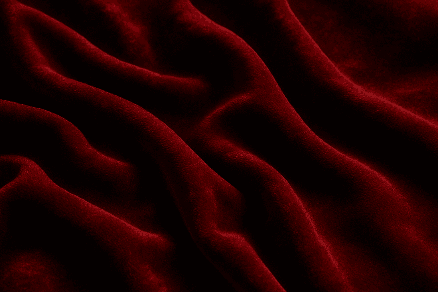 Close-up image showing rich velvet fabric texture with deep folds and subtle highlights