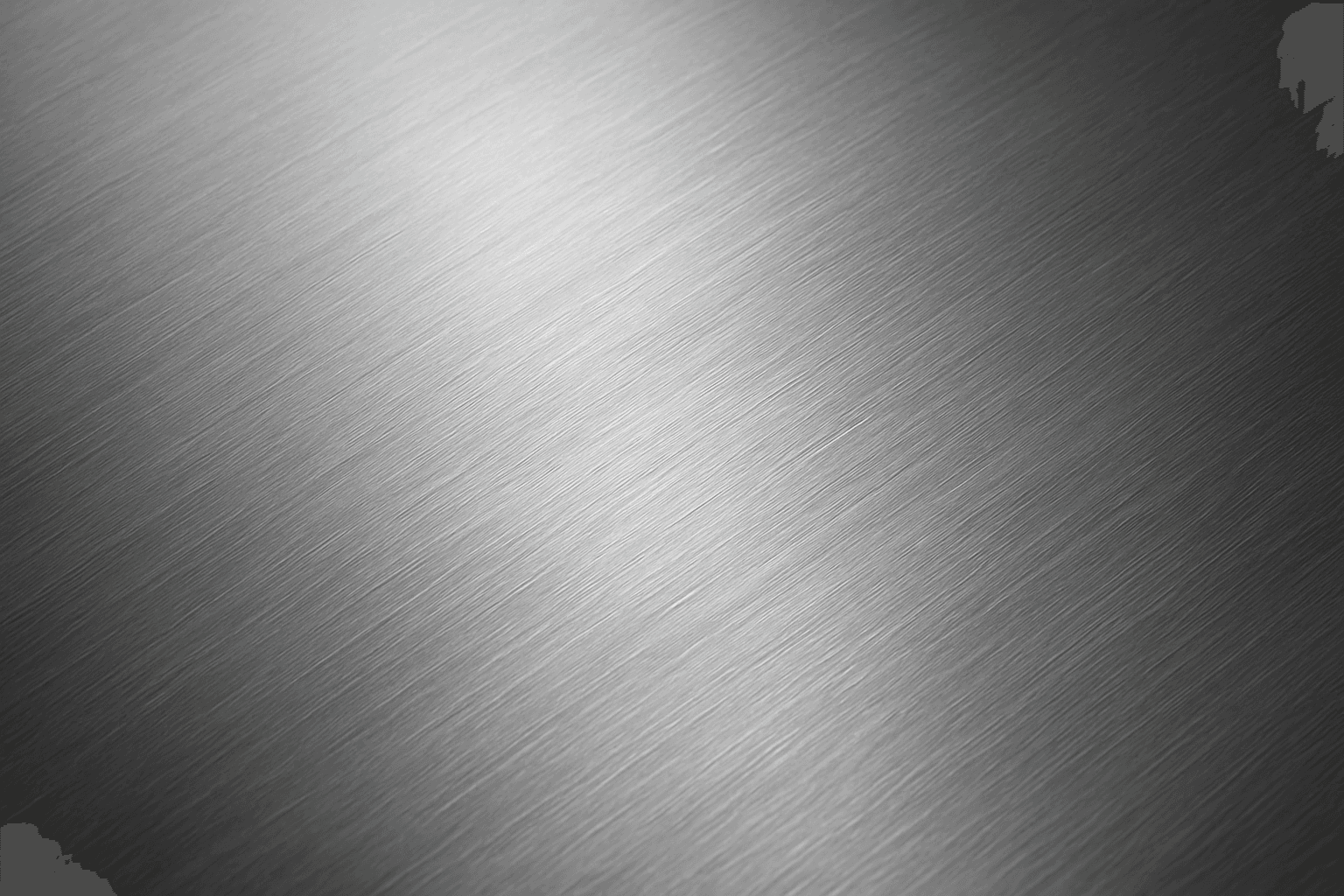 Close-up of brushed metal texture with fine linear grooves and satin finish