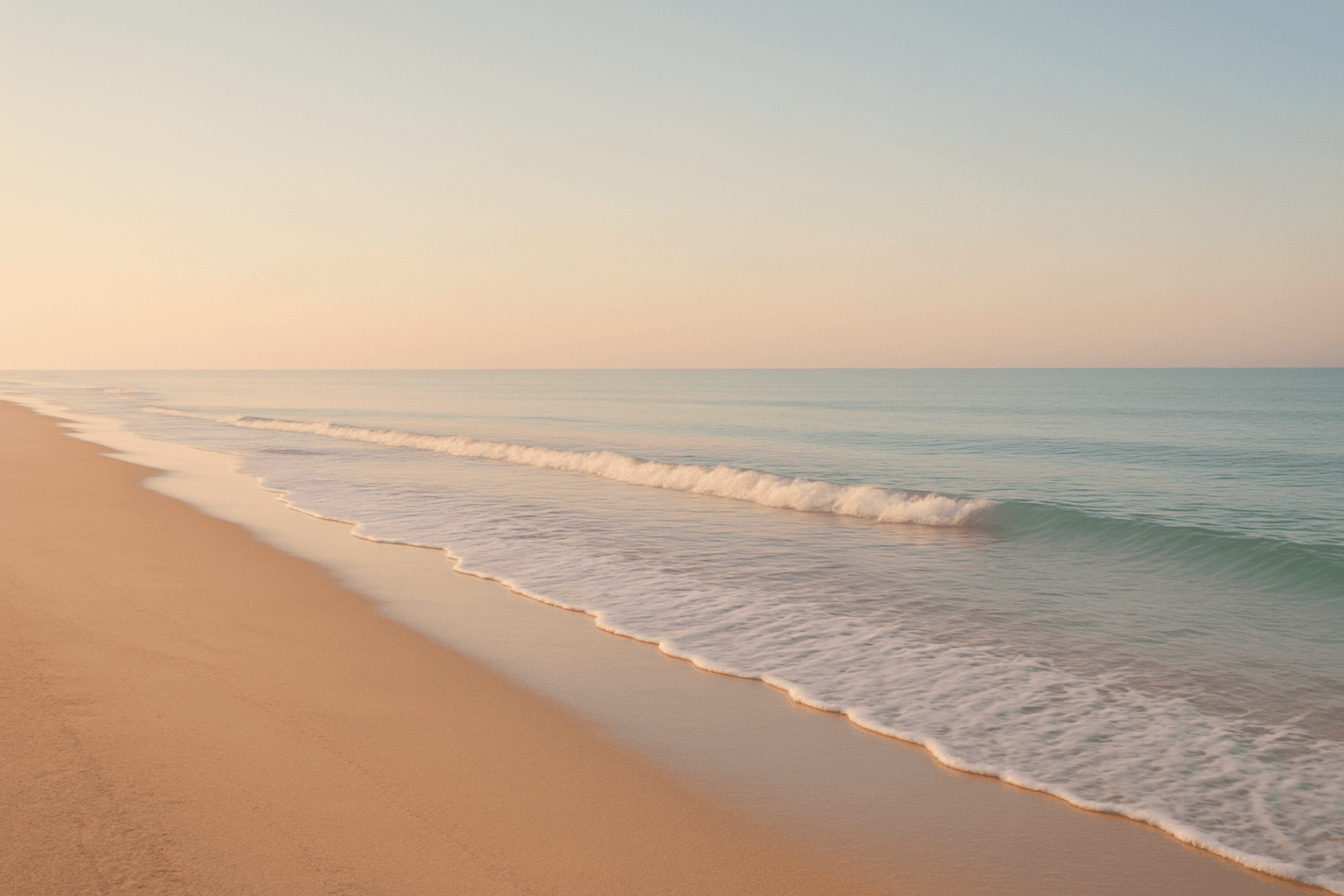 Serene calm beach atmosphere with gentle waves, soft pastel sky, and empty sandy shore at morning light