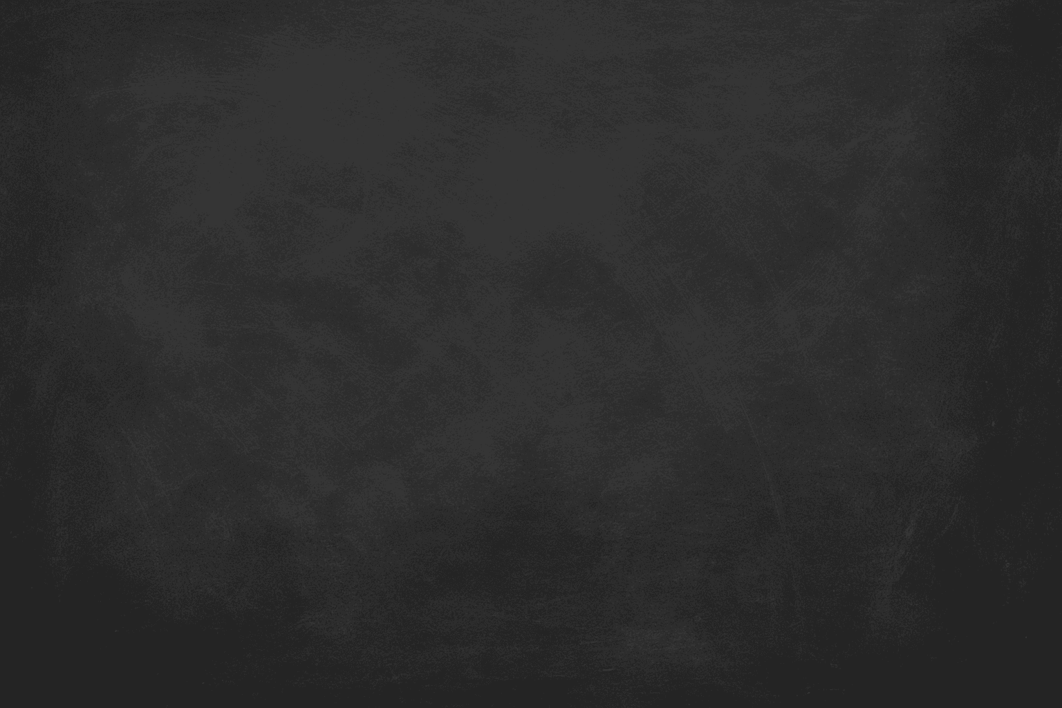 Close-up of chalkboard surface texture showing matte dark background with chalk smudges and subtle scratches