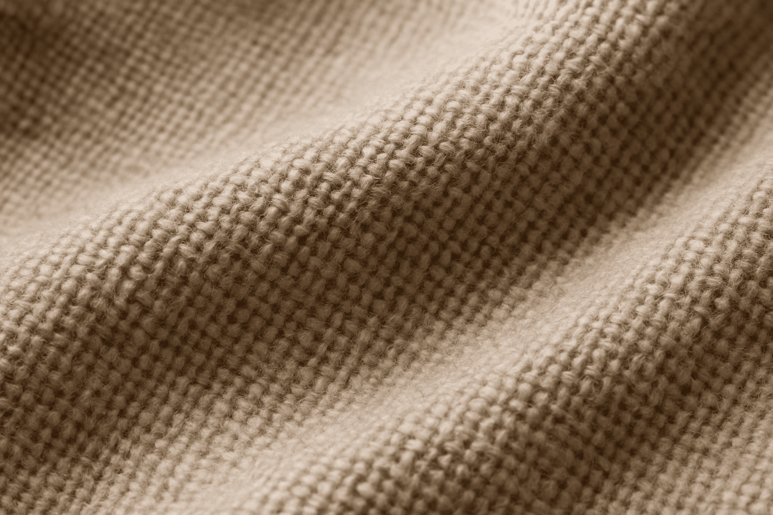 Close-up of detailed fabric texture showing weave and fibers under soft lighting