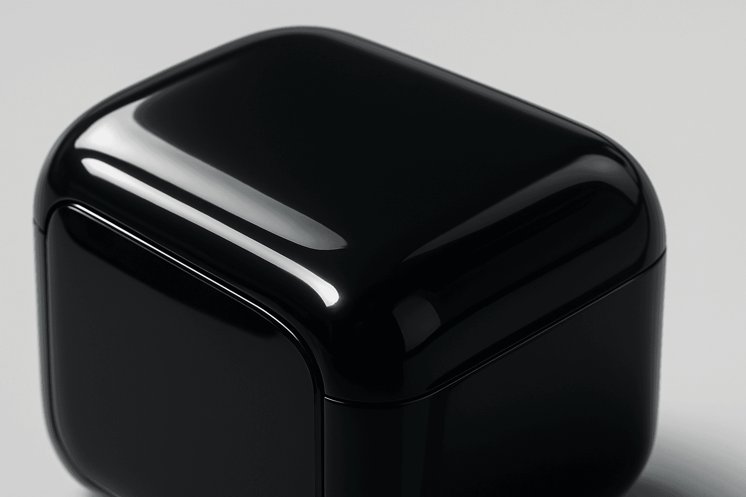 Close-up view of an object with a glossy plastic surface showing smooth, reflective texture and bright highlights