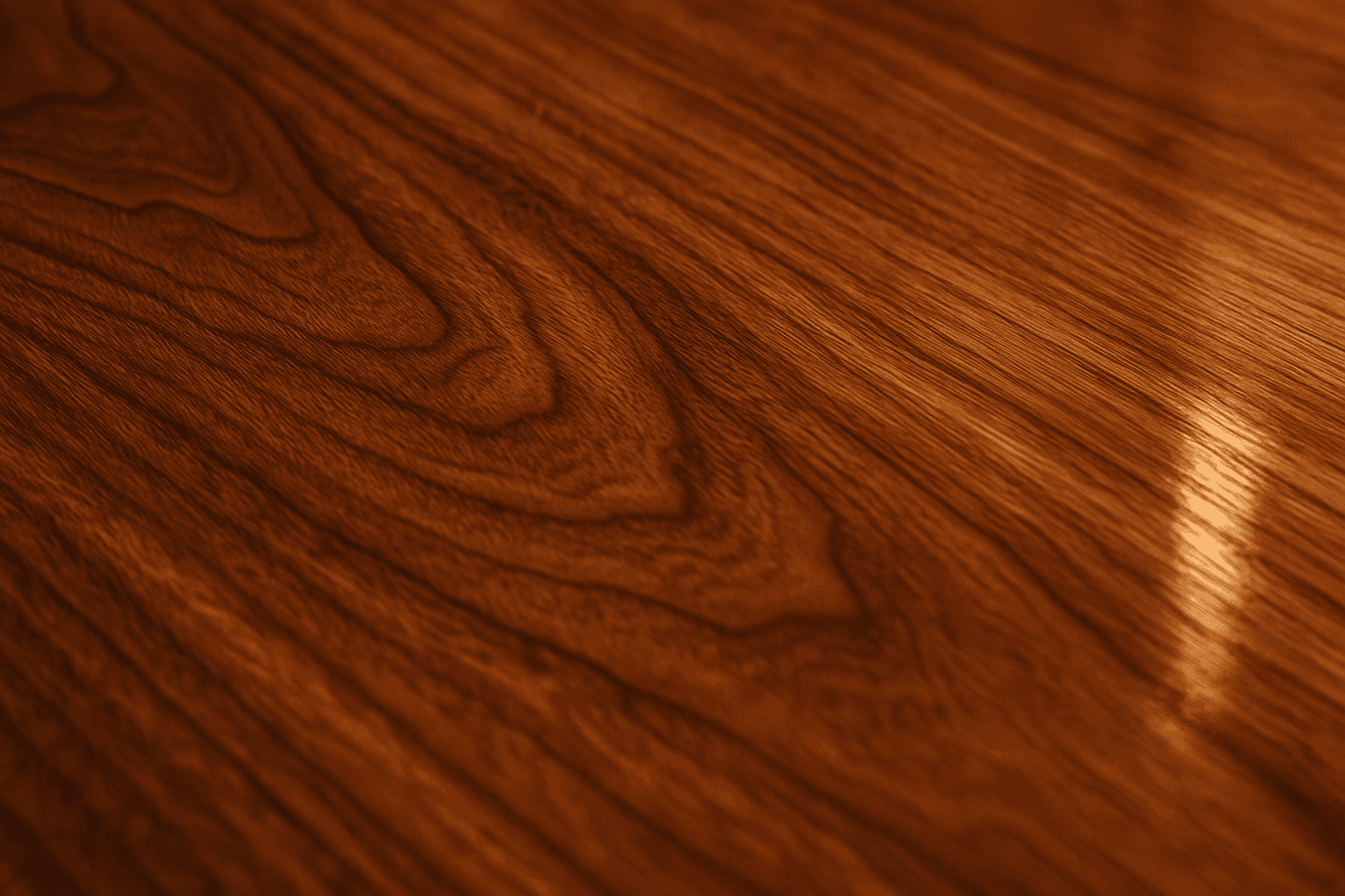 Close-up polished wood grain texture with visible grain and reflective gloss under soft lighting