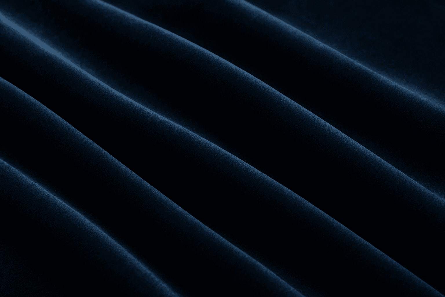 Close-up of fabric with rich soft velvet texture showing its plush and smooth surface